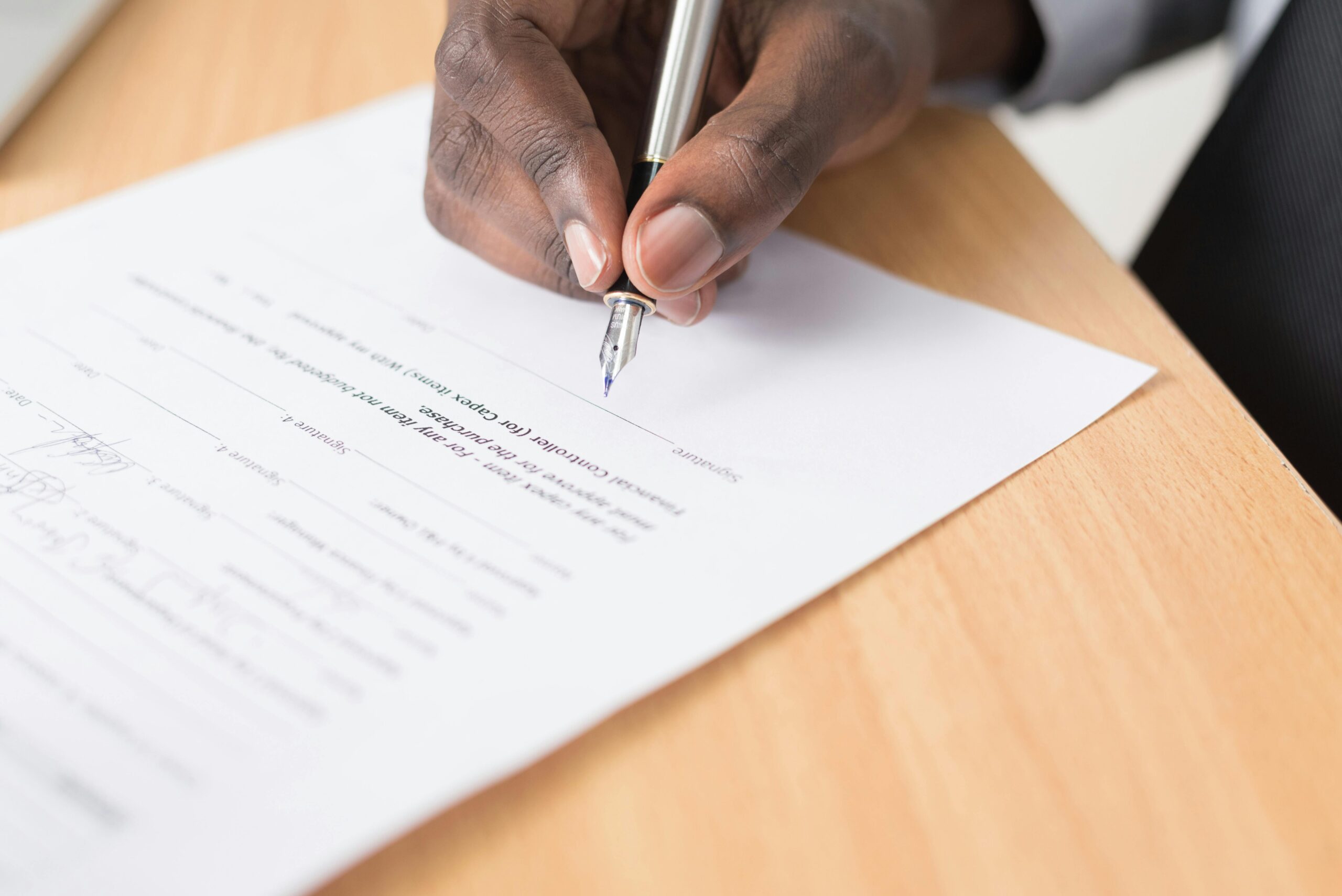 Person filling out a form